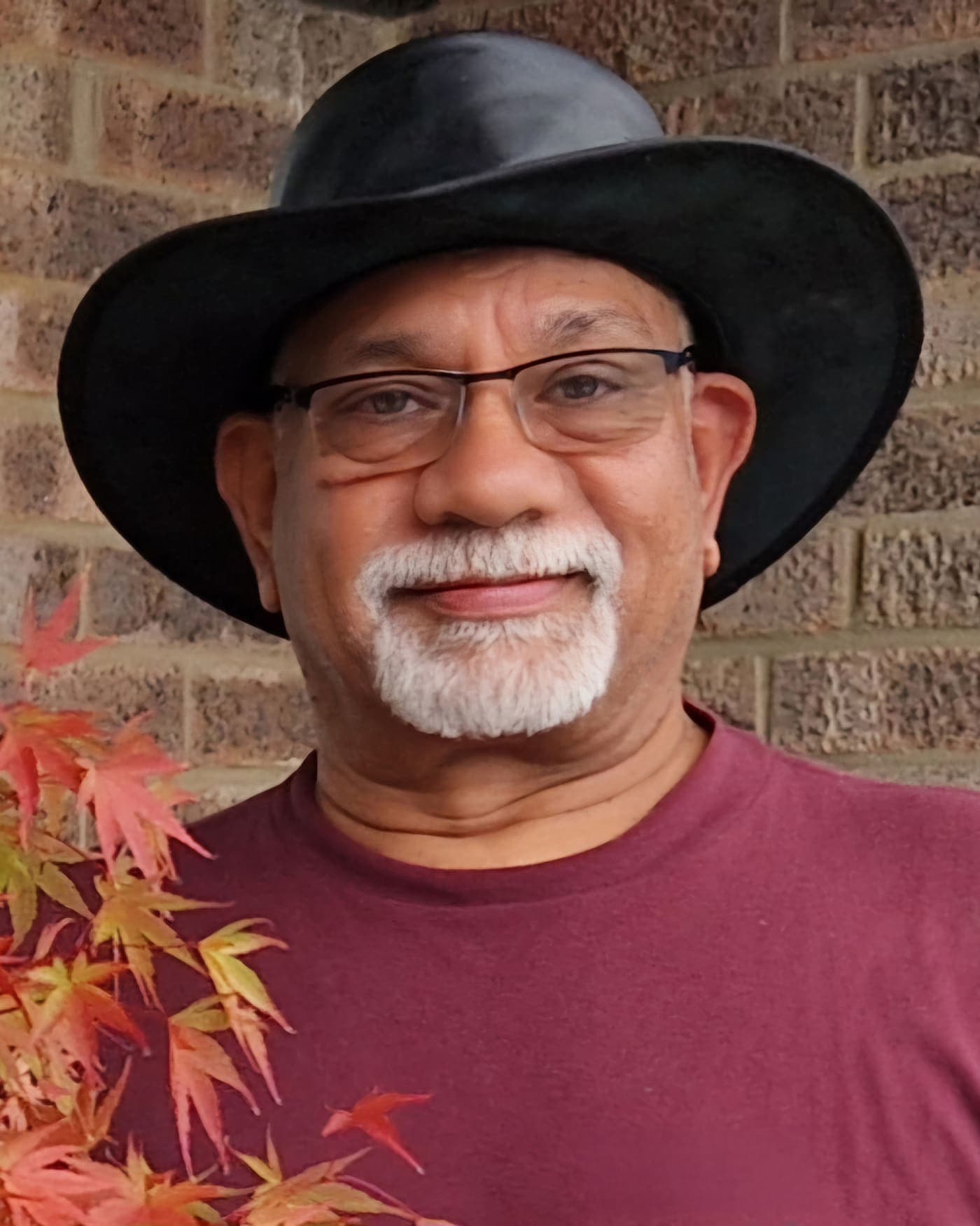 Mark D'Cruz in a black hat for the Founder's Note